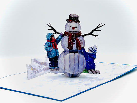 Christmas Kids building snowman