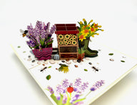 The perfect way to say hello to spring with a pop up daffodil and lavender bug hotel card