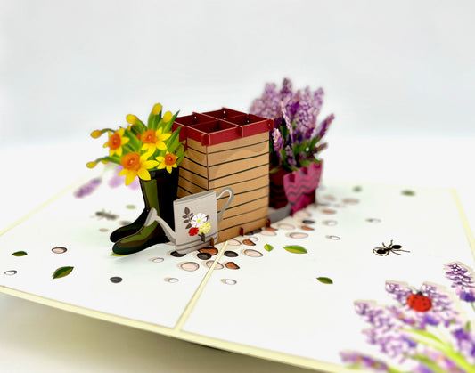 The perfect addition to any spring-birthday celebration or event: a pop up daffodil and lavender bug hotel card