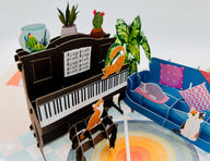 The detailed craftsmanship of this cat and piano pop-up card will delight any cat lover.