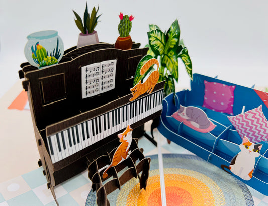 The detailed craftsmanship of this cat and piano pop-up card will delight any cat lover.