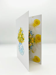 Front of card features a 3D daffodil in full bloom, perfect for as a mother's day pop up card