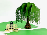 3D pop-up couple on a bridge under a willow tree on a romantic evening, perfect for valentine's day